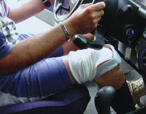 Picture - Person with an artificial lower limb driving a special car